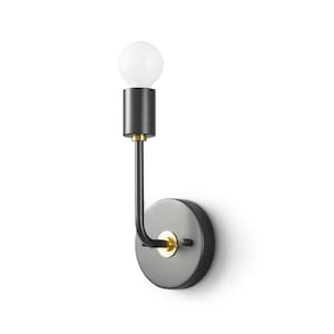May include: Black wall sconce with a gold accent and a clear light bulb. The sconce has a round base and a curved arm.
