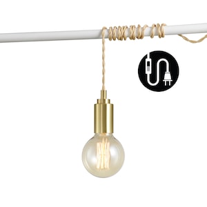 May include: A gold pendant light with a clear glass bulb hangs from a white ceiling fixture. The light is suspended by a natural rope cord.