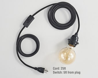 May include: Black electrical cord with a black inline switch and a black plug. The cord is 25 feet long with the switch located 5 feet from the plug. The cord is attached to a black light socket with a clear glass light bulb.