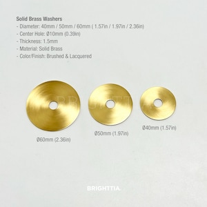 May include: Three solid brass washers with a brushed and lacquered finish. The washers have a center hole and are 1.5mm thick. Sizes include 40mm (1.57in), 50mm (1.97in), and 60mm (2.36in) diameters. The center hole is Ø10mm (0.39in).