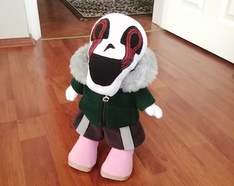 VHSサンズのぬいぐるみ。人形の服はすべて取り外し可能で、腕、脚、頭