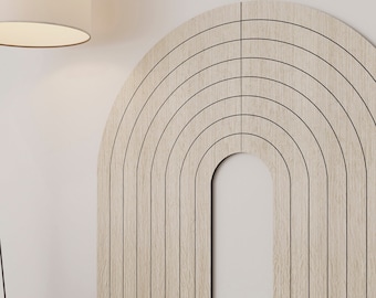 May include: A wooden wall decor in the shape of an arch with a series of thin black lines creating a rainbow effect.