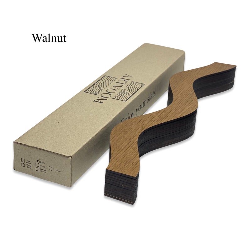 May include: A set of wooden slats in a walnut finish, arranged in a wavy pattern. The slats are packaged in a brown cardboard box with the text "ARTWOOD" and "Enjoy your slats" printed on it.