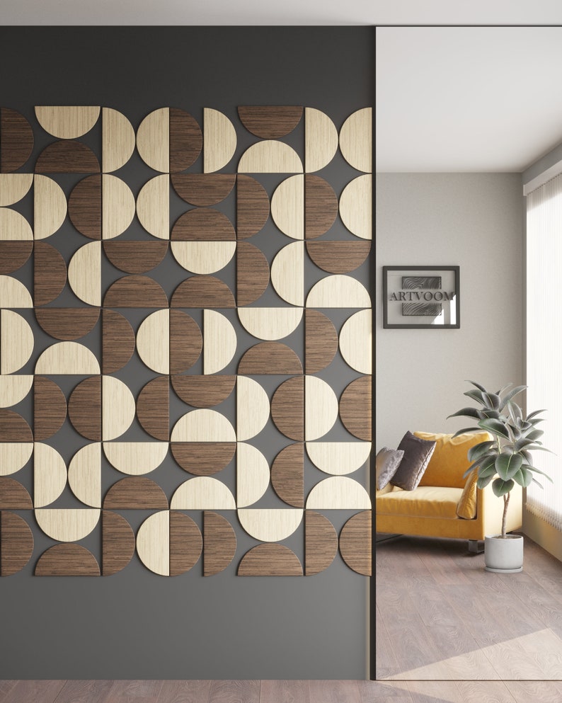 May include: A wall with a geometric pattern made of wood. The pattern is made of half circles in brown and beige wood. The wall is in a room with a yellow armchair and a plant in a white pot.