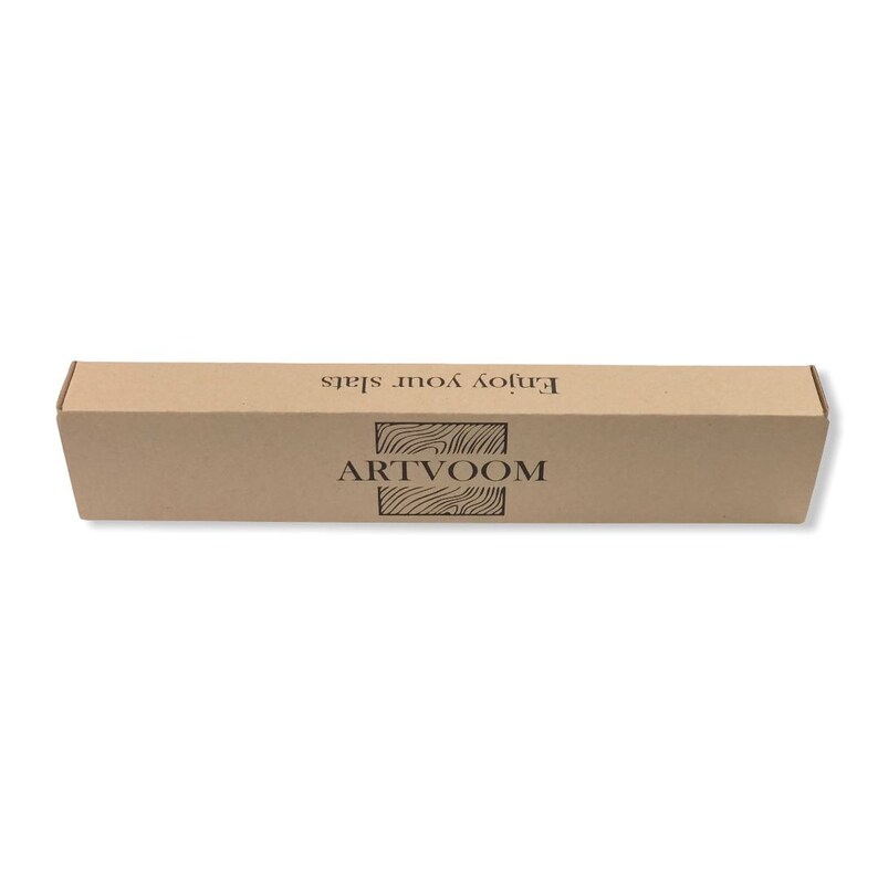 May include: A rectangular, light brown cardboard box featuring the black text "ARTVOOM" centered above a wood grain graphic, with the phrase "Enjoy your slats" printed in black text along the top edge of the box's front panel.