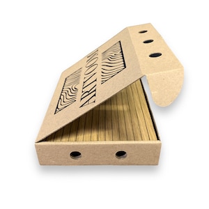 May include: A partially open cardboard box with the word "ARTYOOM" printed in black. The box contains wooden slats. The box has three small holes on the top flap and two on the bottom. The box is light brown.