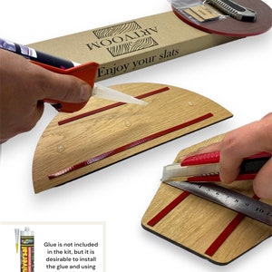 May include: A close-up of a wooden slat wall kit with red adhesive tape and a utility knife. The kit includes instructions on how to install the slats. The text "Enjoy your slats" is printed on the box. Glue is not included in the kit, but it is desirable to install the glue and using double-sided tape, which is included in the kit.