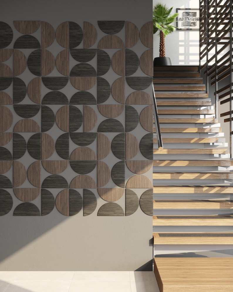May include: A wall with a geometric pattern of brown and black semi-circles. The wall is next to a wooden staircase with a white railing.