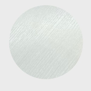 May include: A white circle with a textured surface.