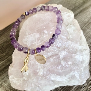 Beaded Amethyst bracelet zodiac charm and breast cancer awareness charm