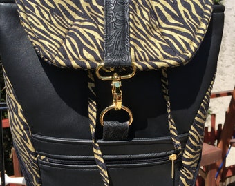small backpack, sling back bag, back pack, over the shoulder