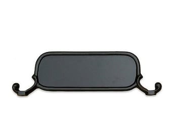 May include: Black metal shelf bracket with decorative scrollwork on the ends. The shelf bracket is designed to support a shelf.