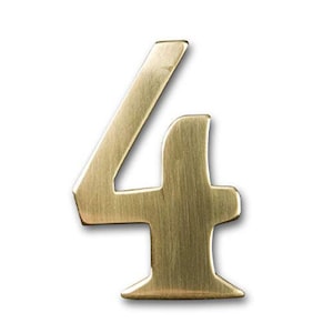 May include: A brushed gold metal number four. The number is a decorative house number.