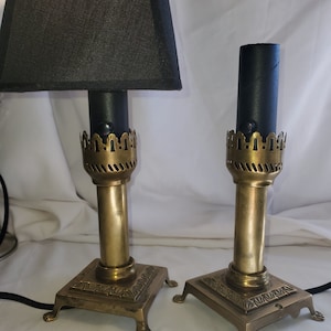 Vintage Orient Train type pair of  brass table lamps. New dimmer switch sockets and cloth covered cord.