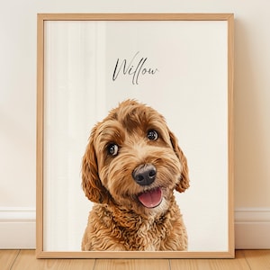 May include: A framed digital illustration of a golden-brown doodle dog with curly fur, dark eyes, and an open mouth showing its tongue. The name Willow is written in black cursive script above the dog's head against a light cream background.