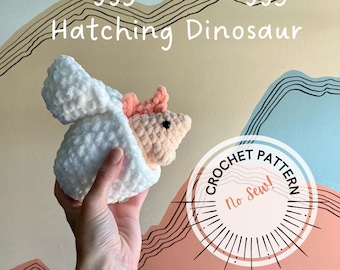 May include: A crocheted dinosaur toy in a white egg-shaped shell. The dinosaur is pink and has a white shell. The toy is being held in a hand against a colorful background with the text "Peggy the Steggy Hatching Dinosaur" and "Crochet Pattern No Sew!"