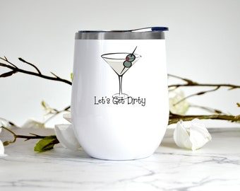 May include: White stainless steel tumbler with a black and white illustration of a martini glass with olives and the text "Let's Get Dirty".