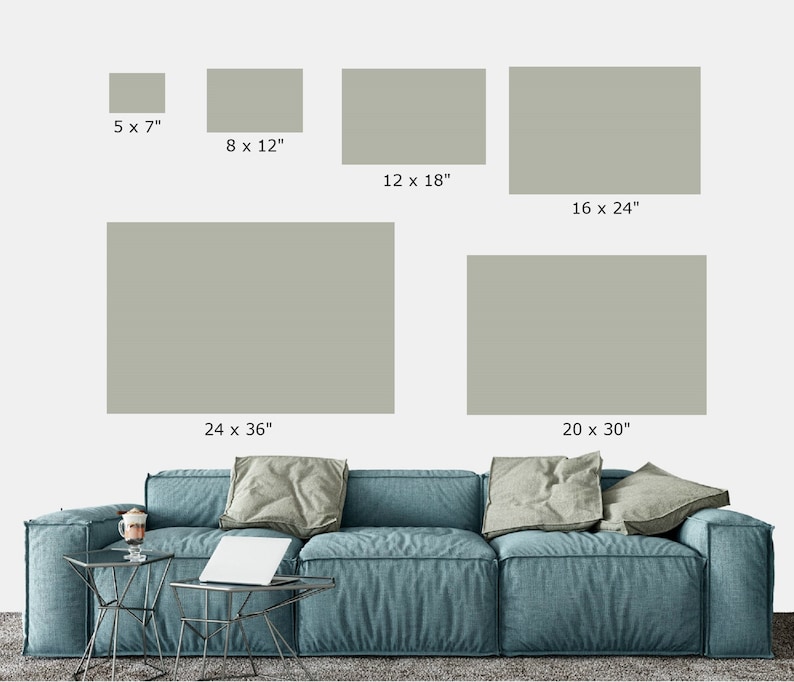 May include: A mockup of different sized prints of a muted green color on a white wall above a blue sofa. The prints are labeled with their dimensions in inches. The smallest print is 5 x 7 inches, the largest is 24 x 36 inches.