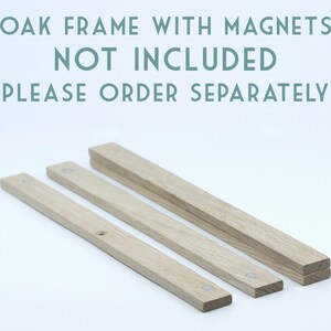 May include: Three wooden strips for a picture frame, made of oak wood. The strips are different lengths and have small metal magnets embedded in them. The text "OAK FRAME WITH MAGNETS NOT INCLUDED PLEASE ORDER SEPARATELY" is visible at the top of the image.