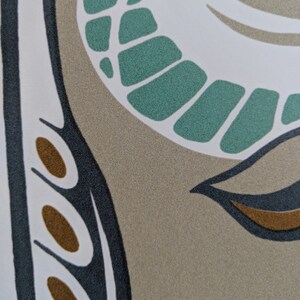 May include: Abstract pattern with teal, brown, black, and white colors. The pattern features a curved shape with a series of teal ovals and a brown oval.
