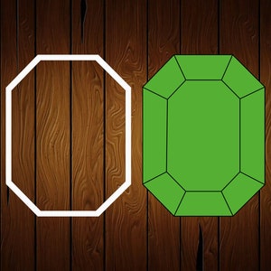 May include: Two images of a gemstone. One is a white outline of an emerald cut gemstone. The other is a solid green emerald cut gemstone. The background is a dark brown wood grain.