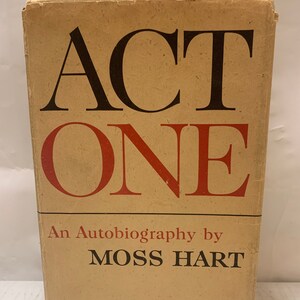 May include: A vintage book cover with the title "ACT ONE" in large, bold, black and red letters. The book is an autobiography by Moss Hart and is published by Random House.