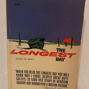 May include: A vintage paperback book cover with a red, white, and blue color scheme. The cover features a green military helmet on a beach with a red sun in the background. The title of the book is "The Longest Day" and the subtitle is "June 6, 1944". The book is by Cornelius Ryan.