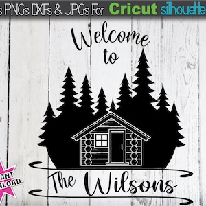 May include: Black and white silhouette of a cabin with a sign that reads "Welcome to The Wilsons" and a row of pine trees behind it.