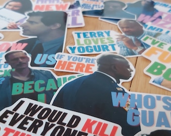 May include: A collection of colorful stickers featuring characters and quotes from the TV show "Brooklyn Nine-Nine". The stickers feature various characters, including Jake Peralta, Amy Santiago, Captain Raymond Holt, and Terry Jeffords. The stickers have a variety of colors, including blue, green, yellow, pink, and orange. The stickers are printed with quotes from the show, such as "Do you know what it means to clap back, Raymond?" and "I've gone full Boyle."