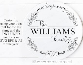 May include: A black and white round sign with the text "new beginnings" in a cursive font. The sign also includes the text "The WILLIAMS Family 2020" with a floral design around the text.