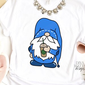 May include: A white t-shirt with a blue gnome holding a coffee cup. The gnome has a white beard and a blue hat with white stitching. The text "Diva Watts Designs" is in the bottom right corner of the image.