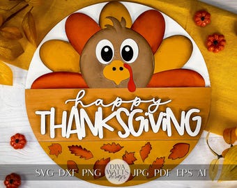 May include: A round wooden Thanksgiving decoration featuring a cartoon turkey with orange, yellow, and brown feathers. The words "happy THANKSGIVING" are written in white script. Decorative leaves and pumpkins surround the sign.