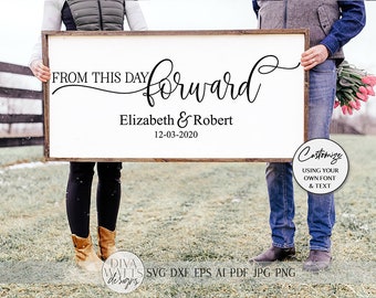 May include: A white wooden sign with the text "FROM THIS DAY forward Elizabeth & Robert 12-03-2020" in black cursive font. The sign is being held by two people in a field.