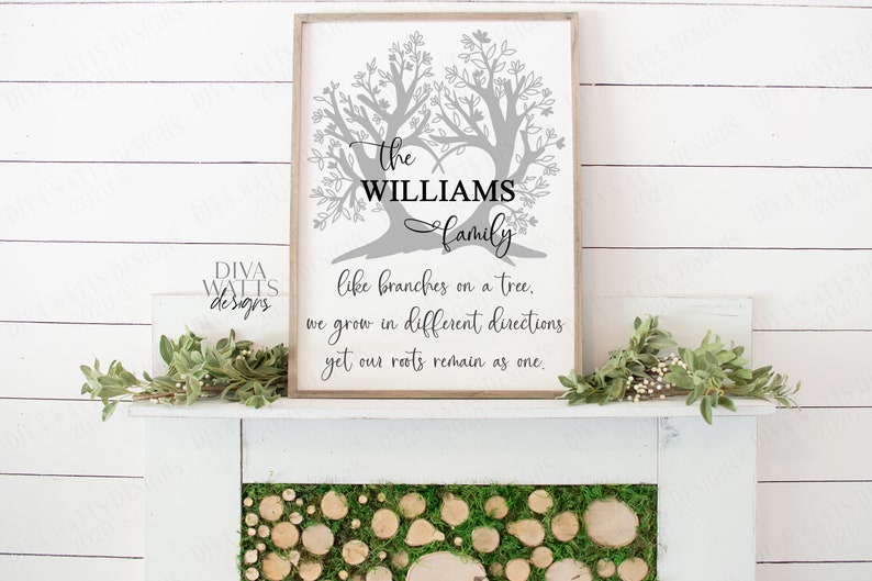 May include: A gray and white sign with two stylized trees forming a heart shape. The text reads "The Williams Family, like branches on a tree, we grow in different directions yet our roots remain as one."