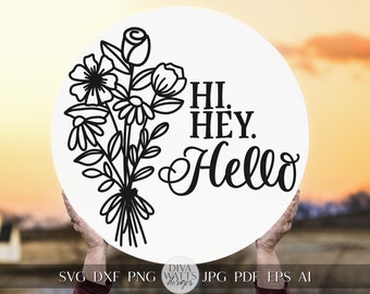 May include: A white round sign with black text and a floral design. The text reads "HI. HEY. Hello".