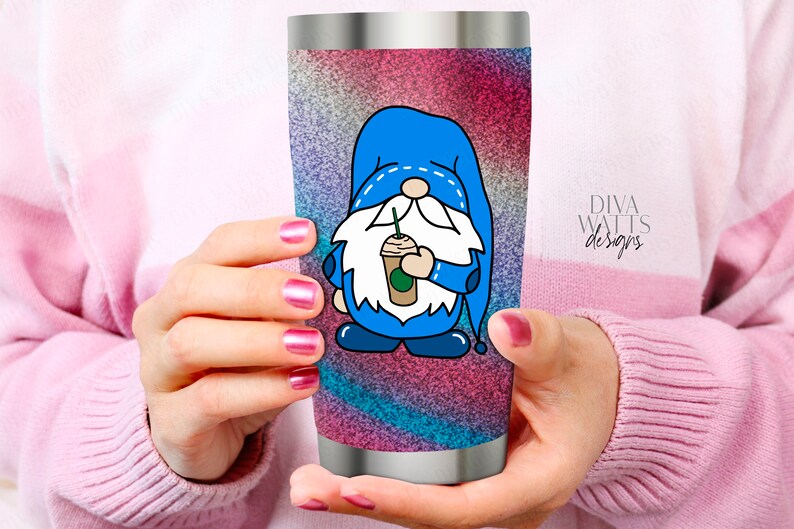 May include: A stainless steel tumbler with a colorful glitter design featuring a blue gnome holding a coffee cup. The gnome has a white beard and a blue hat with white stitching. The text "Diva Watts Designs" is visible on the tumbler.