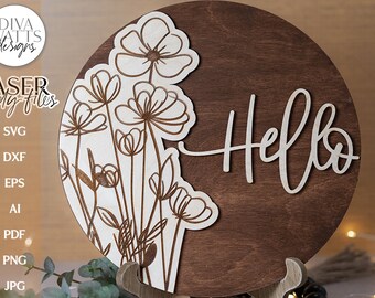 May include: A wooden round sign with the word "Hello" in white script on the right side. The left side features a white outline of a floral design.