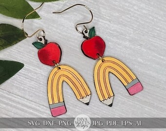 May include: A pair of earrings featuring a red apple and a yellow pencil with a pink eraser. The pencil is shaped like a rainbow.