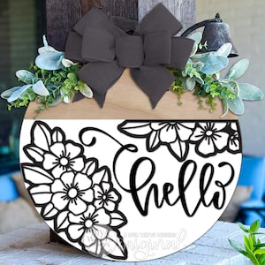 Digital SVG file for a floral round door hanger with a split design and “hello” script. This instant download laser cut design is made for DIY front door and porch décor projects. The SVG digital file allows makers to create a custom round door hanger using their own materials, paint, and finishes. Perfect for laser cutting, crafting seasonal or everyday signs, and creating personalized porch décor with Glowforge or other laser machines.