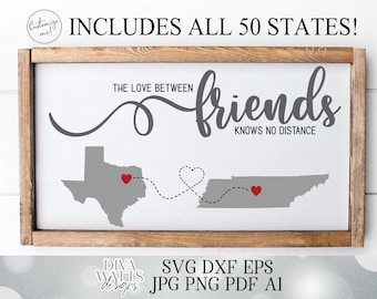 May include: A framed sign with a gray wooden frame and a white background. The sign features a gray outline of Texas and Tennessee with a dotted line connecting the two states. The text "The love between friends knows no distance" is written in gray cursive lettering. Two red hearts are placed on the states.