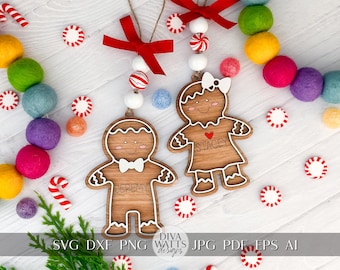 May include: Two wooden gingerbread person ornaments with painted details. The ornaments are decorated with white icing and have the names "Jeremy" and "Stacey" written on them. The ornaments are hanging from a white string with red and white candy cane beads.