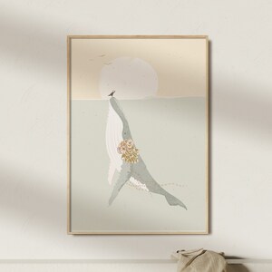 May include: A digital art print featuring a light blue whale with a floral design on its side, swimming in a light blue ocean with a yellow sun in the background.