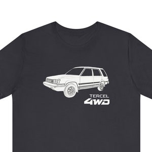 May include: A dark grey t-shirt with a white outline of a Toyota Tercel 4WD car. The text "Tercel 4WD" is printed below the car.