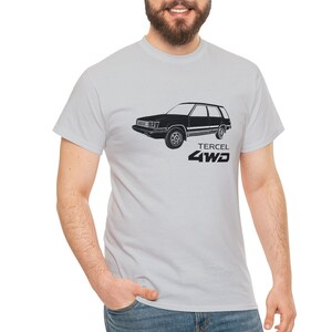 May include: A light grey t-shirt with a black silhouette of a Toyota Tercel 4WD wagon. The text "Tercel 4WD" is printed below the car.