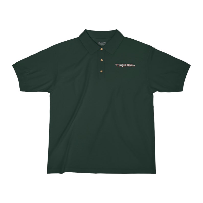 May include: A dark green polo shirt with a white embroidered logo that says "TRD OFF ROAD" on the left chest.