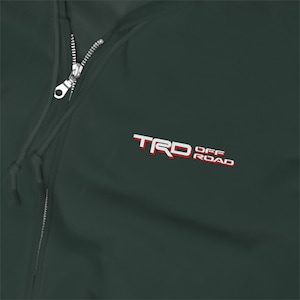 May include: A dark green zippered hoodie with the text "TRD OFF ROAD" embroidered in white and red.