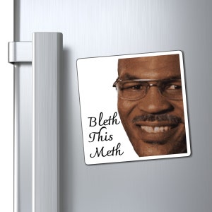 May include: A white square magnet with a close-up image of a man's face with glasses and a mustache. The text "Bleth This Meth" is written in black cursive font below the image.