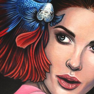 May include: A detailed illustration featuring a person with dark hair and light eyes positioned next to a vibrant blue and red betta fish. The fish has long, flowing fins that extend behind the person's head, creating a colorful contrast.