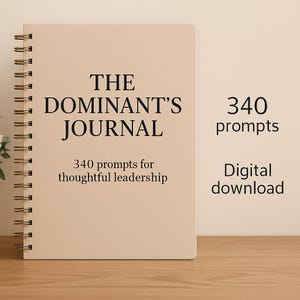 May include: A spiral-bound journal with a beige cover. The cover reads "THE DOMINANT'S JOURNAL" in black text, with "340 prompts for thoughtful leadership" below. The journal is on a wooden surface, with the words "340 prompts" and "Digital download" to the right.
