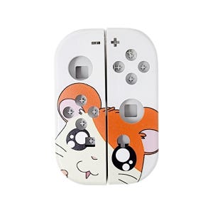 May include: White Nintendo Switch Joy-Con controllers with a cartoon hamster design. The hamster has orange fur, white eyes, and a pink nose. The controllers have the standard Nintendo Switch buttons.